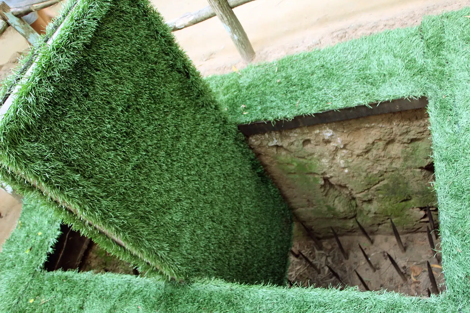 A camouflaged trapdoor and spike trap at the Cu Chi tunnel site northwest of Ho Chi Minh City, Vietnam