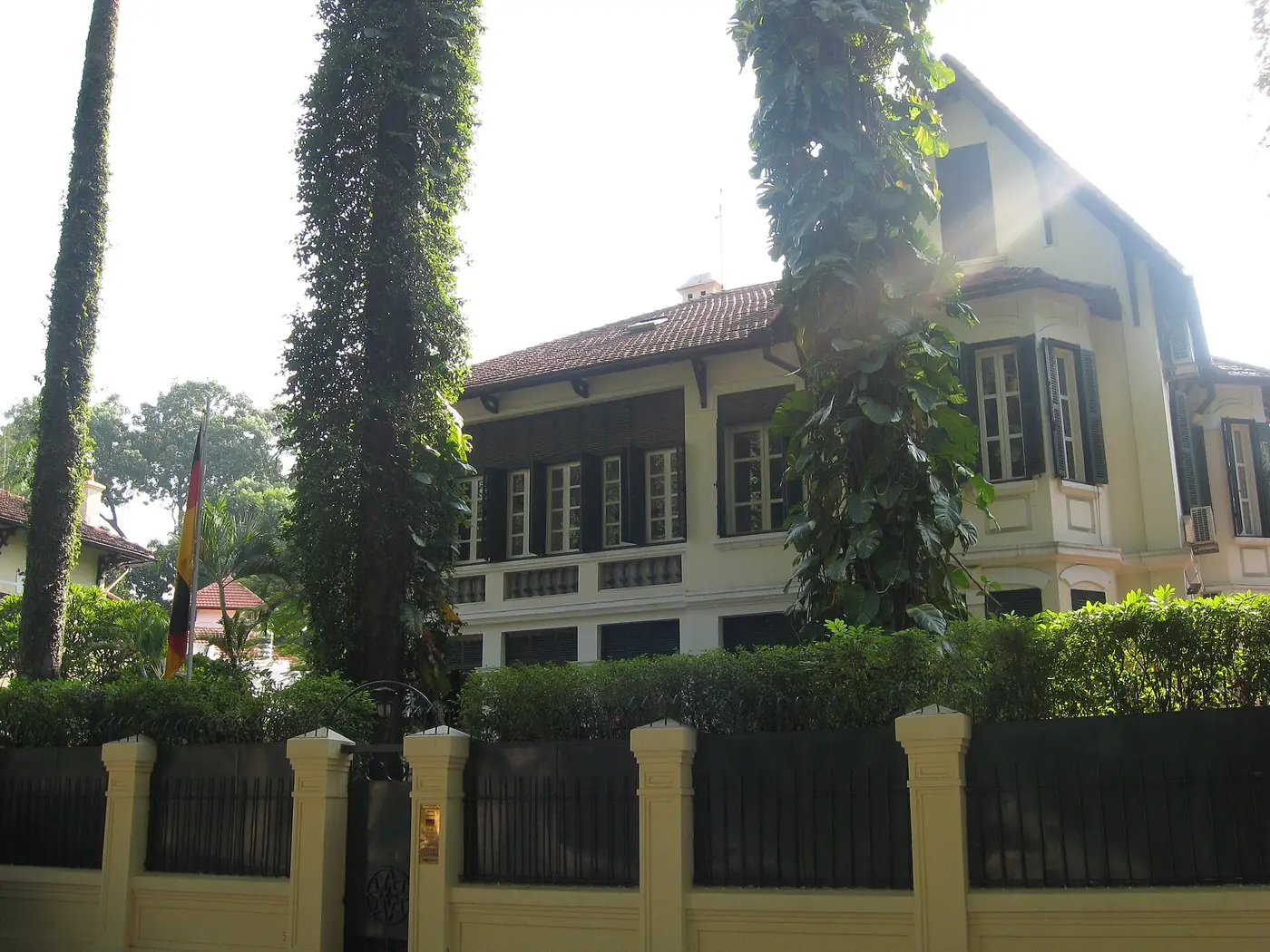Tree-lined street with French colonial architecture in central Hanoi, Vietnam
