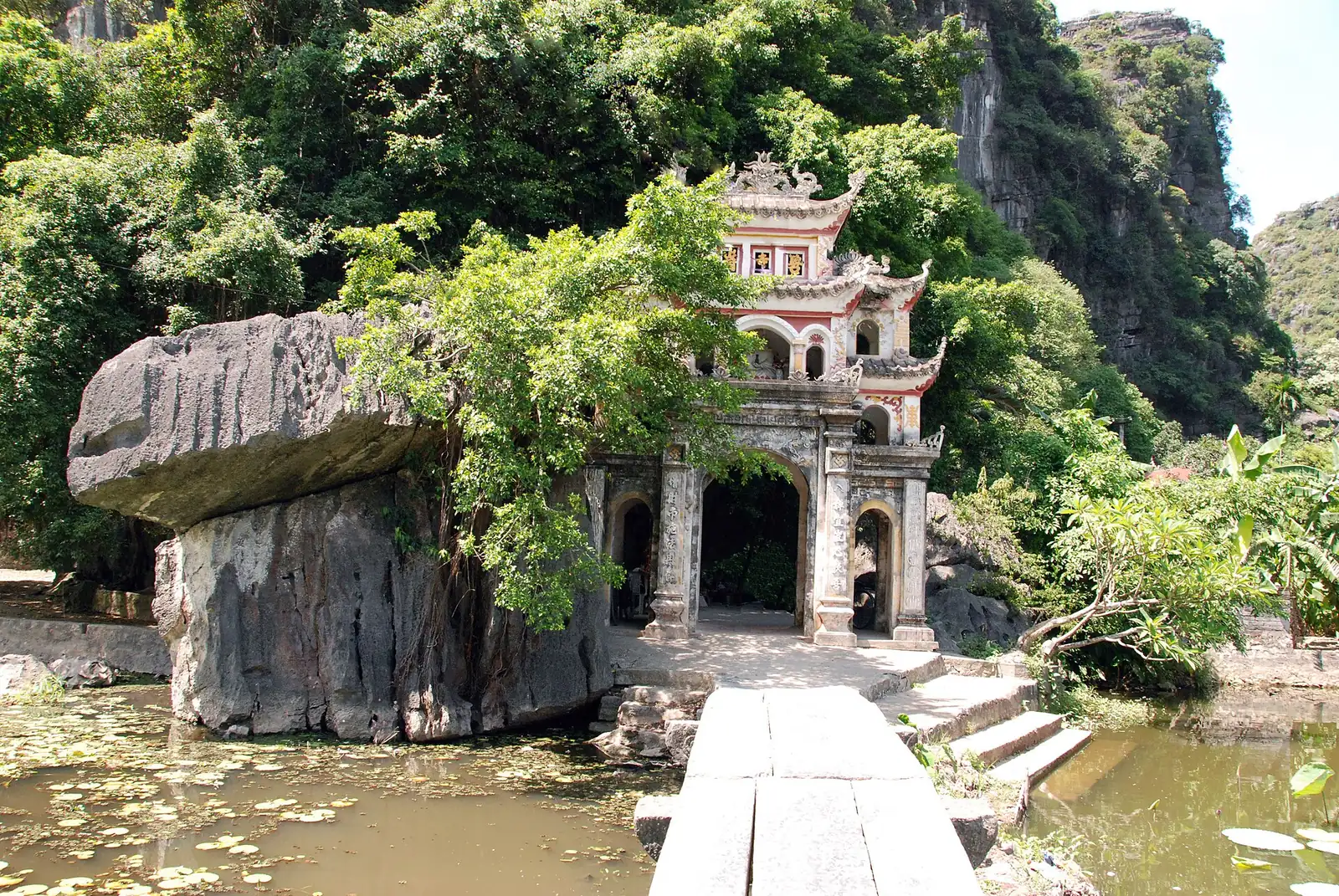 The tiered Bich Dong pagoda built into a cliff face near Tam Coc, Ninh Binh, Vietnam