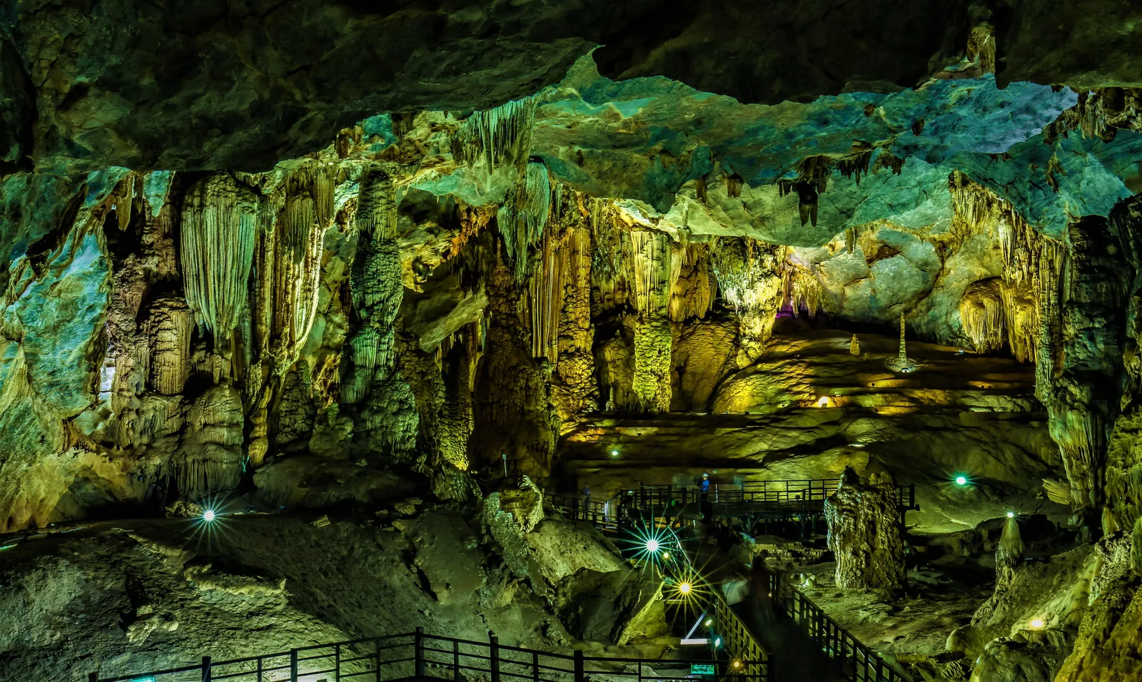 A wide illuminated cave chamber with stalactites inside Paradise Cave, Phong Nha-Ke Bang National Park, Vietnam