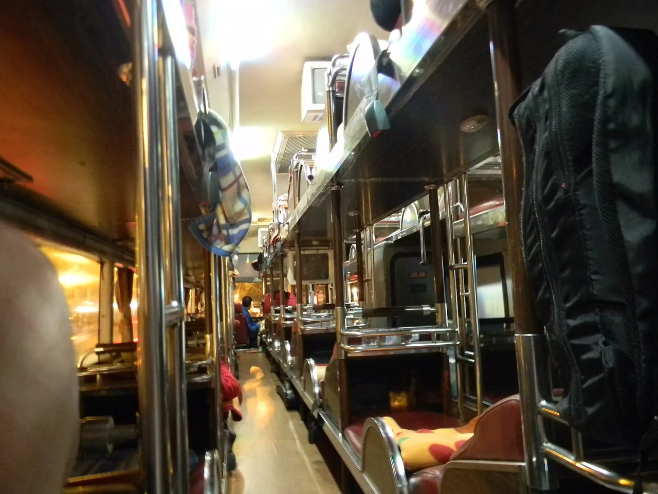 Interior of a Vietnamese sleeper bus with reclining berths in rows