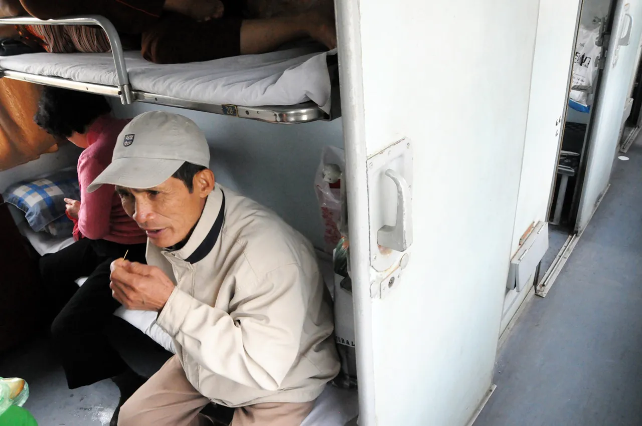A sleeper compartment with berths on a Vietnamese overnight train