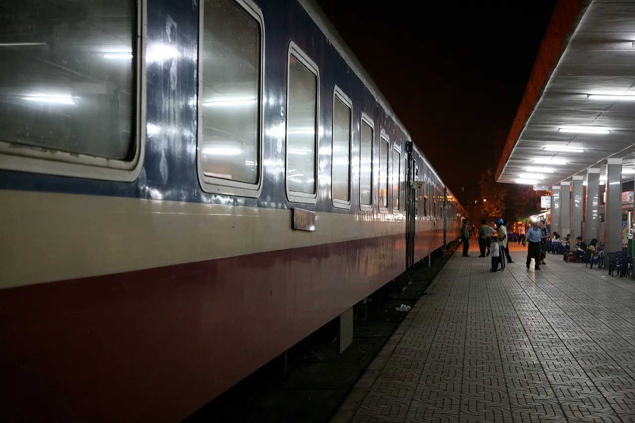 Passengers on a railway station platform in Vietnam