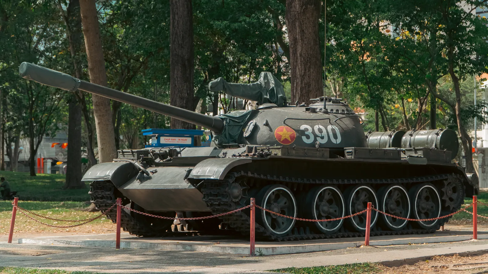 A preserved tank on display in a museum courtyard in Ho Chi Minh City