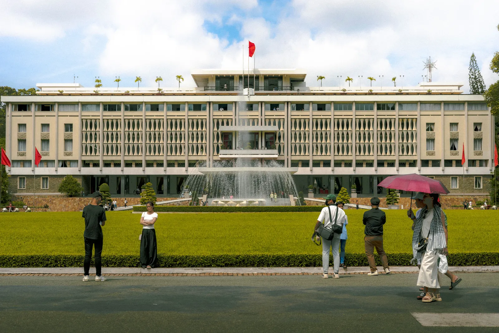 Visitors on the plaza in front of the Reunification Palace in Ho Chi Minh City