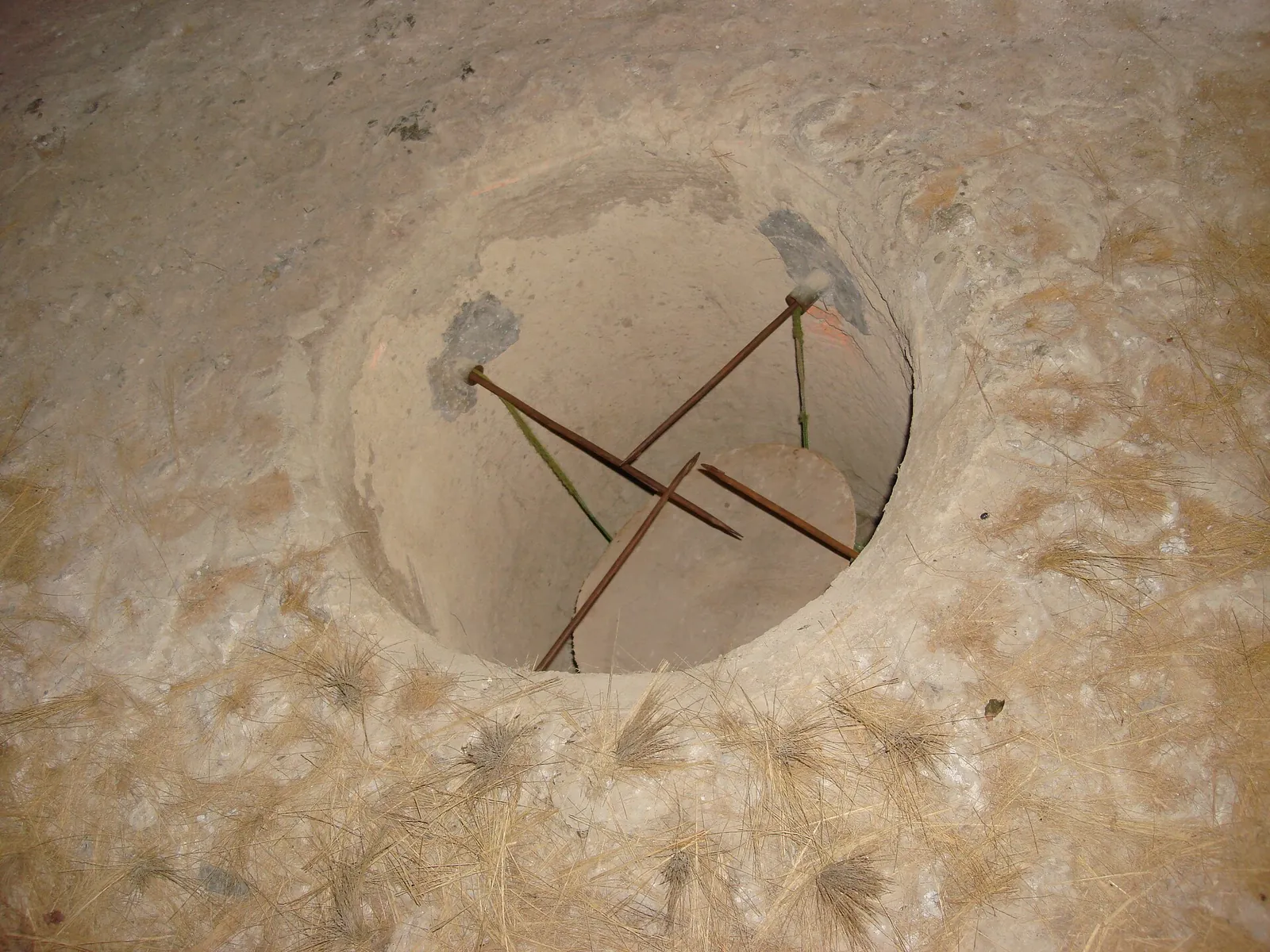 A concealed tunnel entrance at the Cu Chi tunnel network near Ho Chi Minh City, Vietnam