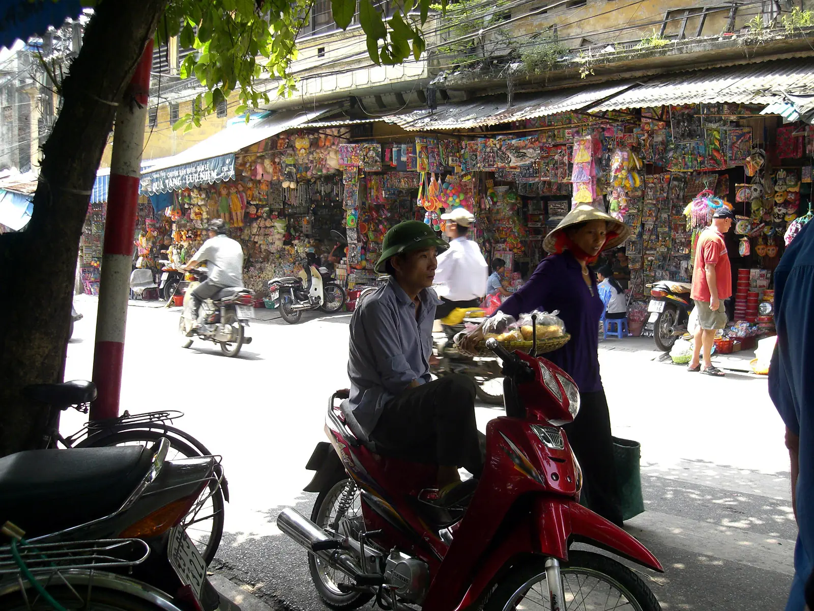 Street food stall with low stools in the Old Quarter of Hanoi, Vietnam