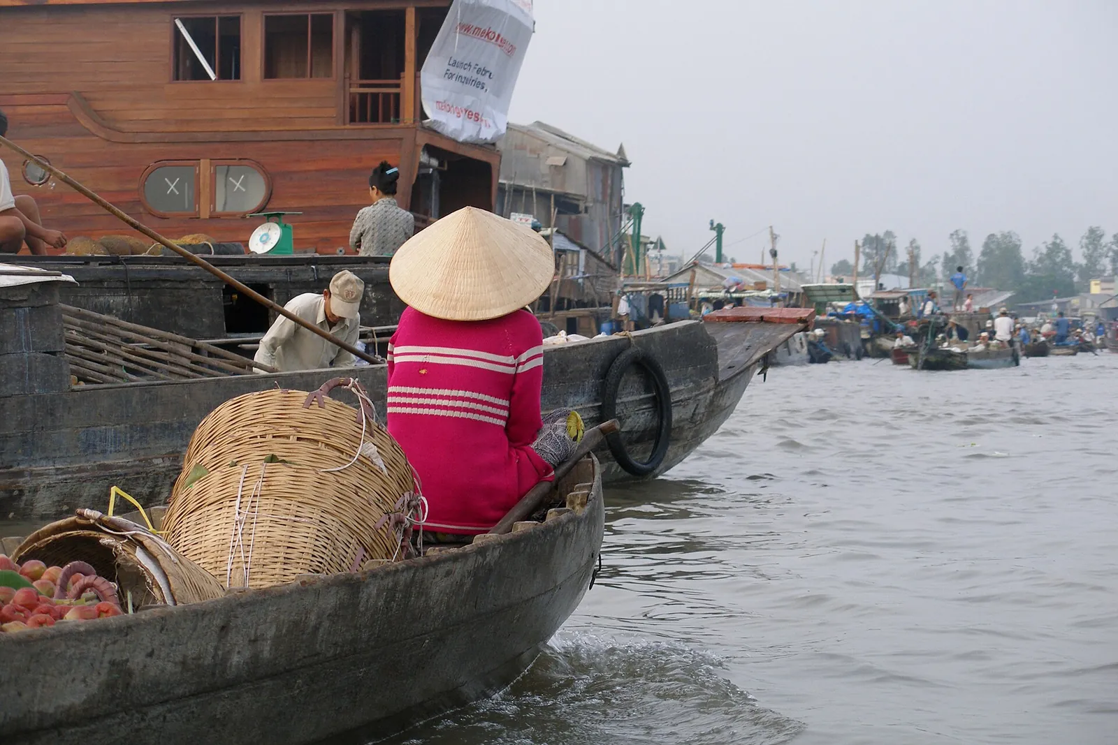 Boats loaded with produce trading at a floating market in the Mekong Delta near Can Tho, Vietnam