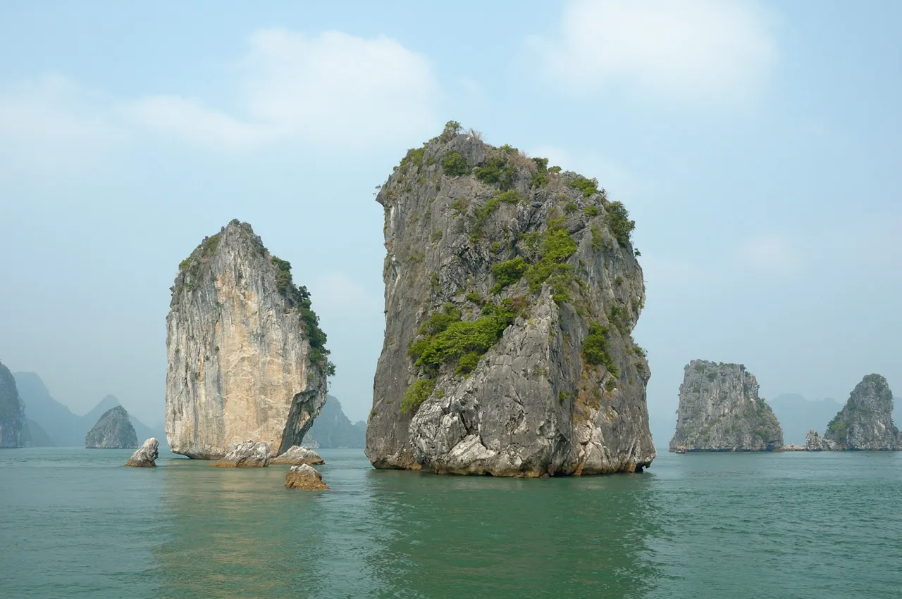 Limestone karst towers rising from the water at Ha Long Bay in northern Vietnam