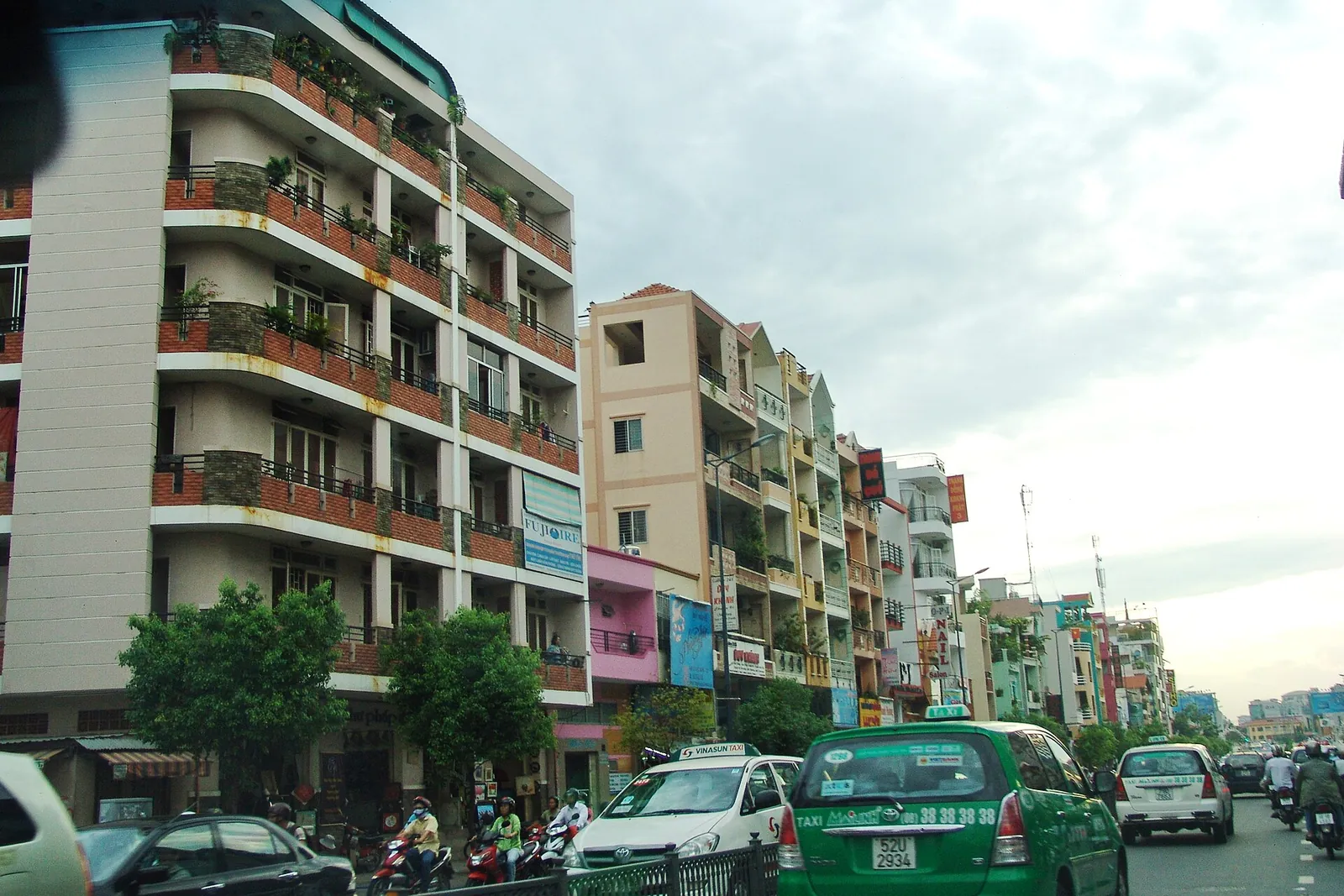Taxis on a street in Ho Chi Minh City, Vietnam, where ride-hailing apps remove fare disputes