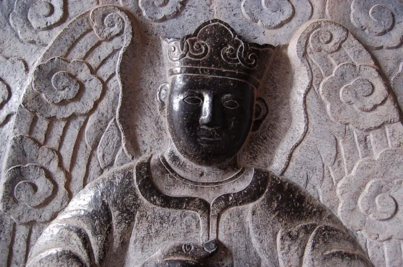 A carved stone angel relief at Phat Diem cathedral