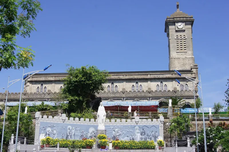 The Mountain Church in Nha Trang, a grey stone building with a clock tower