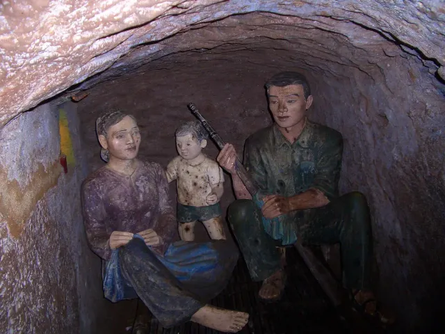 A reconstructed family room in a tunnel with life size figures